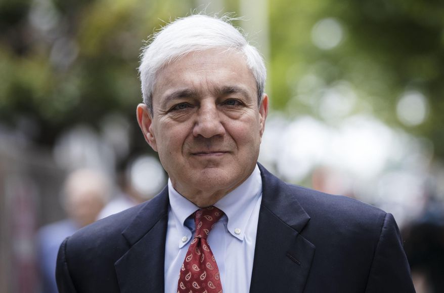 FILE - In this June 2, 2017, file photo, former Penn State President Graham Spanier departs after his sentencing hearing at the Dauphin County Courthouse in Harrisburg, Pa. A federal judge will consider ex-Penn State president Graham Spanier's argument that his conviction should be thrown out, a week before he's due to report to jail. The hearing Thursday, April 25, 2019, concerns Spanier's argument he was wrongly convicted in Pennsylvania state court for mishandling a 2001 complaint about Jerry Sandusky under a version of the law that wasn't in place at that time. (AP Photo/Matt Rourke, File)
