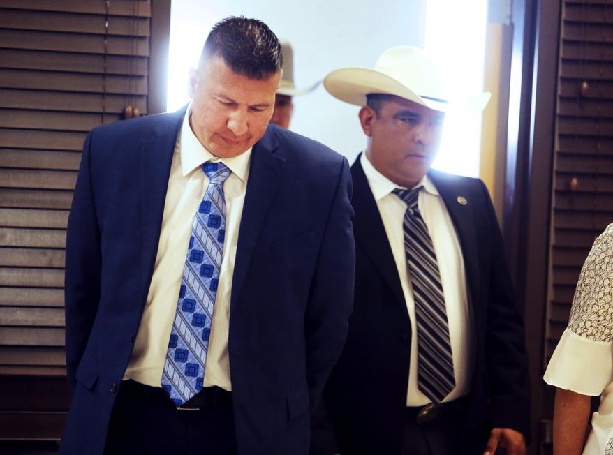 Edinburg Mayor Richard Molina walks into the courtroom before being arraigned by Justice of the Peace Precinct 2 Jaime "Jerry" Muñoz on charges of trying to rig his own 2017 election victory, Thursday, April 25, 2019, in Pharr, Texas. (Richard Molina/The Monitor via AP)