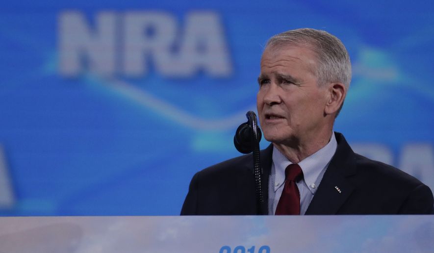 Nation Rifle Association President Col. Oliver North speaks at the National Rifle Association Institute for Legislative Action Leadership Forum in Lucas Oil Stadium in Indianapolis, Friday, April 26, 2019. (AP Photo/Michael Conroy)