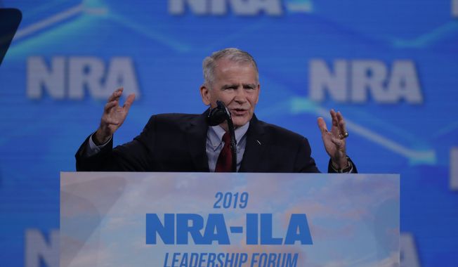 Nation Rifle Association President Col. Oliver North speaks at the National Rifle Association Institute for Legislative Action Leadership Forum in Lucas Oil Stadium in Indianapolis, Friday, April 26, 2019. (AP Photo/Michael Conroy)