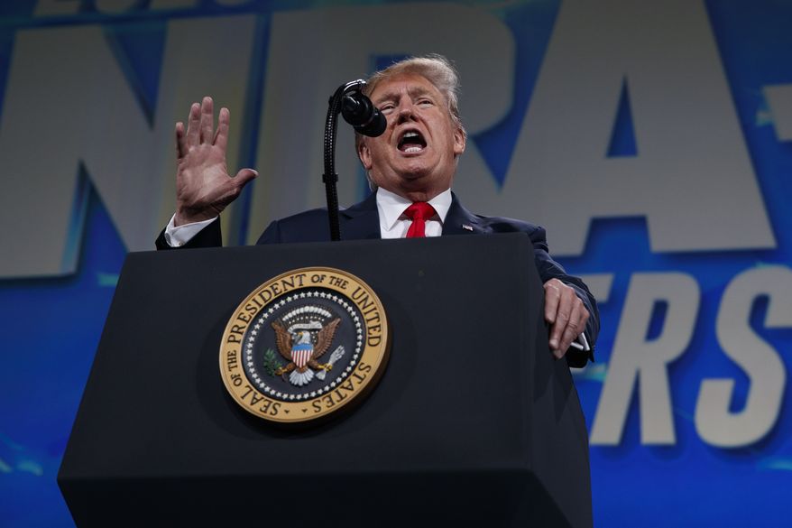 President Donald Trump speaks to the annual meeting of the National Rifle Association, Friday, April 26, 2019, in Indianapolis. (AP Photo/Evan Vucci) ** FILE **