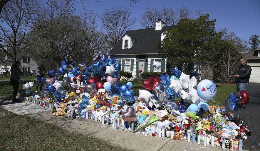 A memorial for 5-year-old Andrew &amp;quot;AJ&amp;quot; Freund grows outside of his family&#39;s home on Thursday, April 25, 2019 in Crystal Lake, Ill. The child&#39;s parents, 36-year-old Joann Cunningham and 60-year-old Andrew Freund Sr., appeared in court Thursday on first-degree murder and other charges. A judge ordered both held in jail on $5 million bail. (Stacey Wescott/Chicago Tribune via AP)