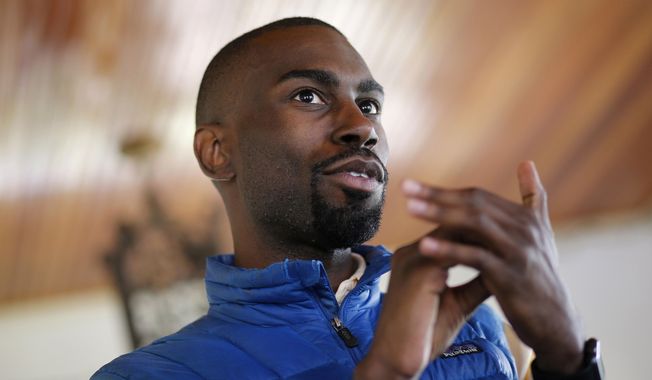 FILE – In this March 26, 2016, file photo, Black Lives Matter activist DeRay Mckesson, who was seeking the Democratic nomination to run for mayor of Baltimore, chats with campaign volunteers in Baltimore. A federal appeals court says a Louisiana police officer injured during protests over the 2016 killing of a black man can sue Mckesson, a Black Lives Matter organizer on the grounds he acted negligently by leading people to block a highway.  The 5th U.S. Circuit Court of Appeals ruled Wednesday, April 24, 2019 that the officer should be able to argue that Mckesson didn&#x27;t exercise reasonable care in leading protesters onto the highway, setting up a police confrontation in which the officer was injured by a thrown concrete block. (AP Photo/Patrick Semansky, File)