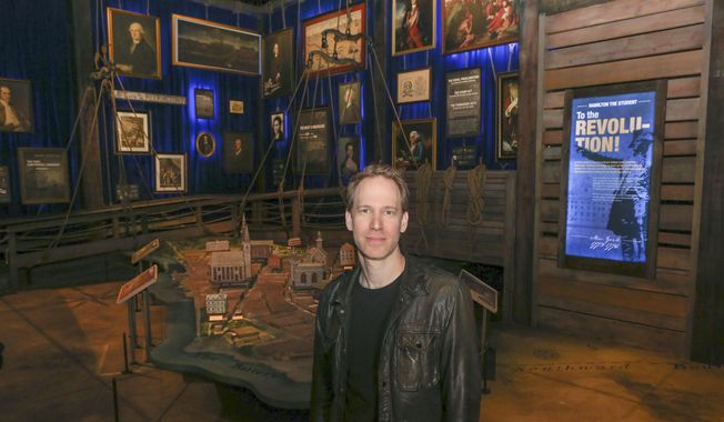 Hamilton exhibition creative director and designer David Korins, poses for a portrait at the exhibit in Chicago, Thursday, April 25, 2019. Korins is standing in one of 19 rooms that make up a 360-degree immersive experience to accompany &amp;quot;Hamilton&amp;quot; the musical. Visitors can follow Alexander Hamilton&#x27;s life as a trader in St. Croix to his death in a duel with Aaron Burr in 1804. (AP Photo/Teresa Crawford)