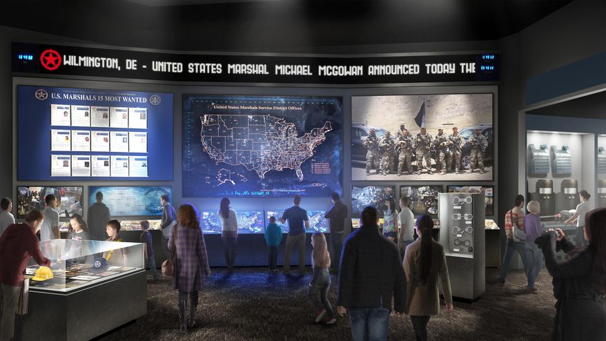 This artist's rendering provided by the United States Marshals Museum Friday, April 26, 2019, depicts a proposed exhibit showing the work U.S. Marshals do today at a future museum in Fort Smith, Arkansas. The $50 million museum dedicated to the U.S. Marshals is about $15 million under-funded, and the museum's foundation recently announced a crowdfunding effort to raise money. Though the building will be dedicated in September as originally planned, the museum's opening has been pushed back to sometime next year. (United States Marshals Museum via AP)