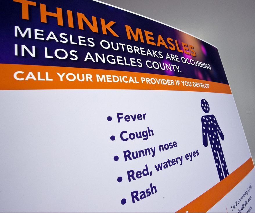A poster released by Los Angeles County Department of Public Health is seen as experts answer questions regarding the measles response and the quarantine orders in Los Angeles Friday, April 26, 2019. Hundreds of students and staff members at two Los Angeles universities were sent home this week in one of the most sweeping efforts yet by public health authorities to contain the spread of measles in the United States, where cases have reached a 25-year high. (AP Photo/Damian Dovarganes) **FILE**