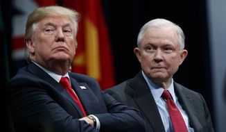 In this Dec. 15, 2017, file photo, President Donald Trump sits with then-Attorney General Jeff Sessions during the FBI National Academy graduation ceremony in Quantico, Va. (AP Photo/Evan Vucci) ** FILE **