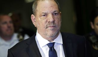FILE - In this Oct. 11, 2018 file photo, Harvey Weinstein enters State Supreme Court in New York. An important pretrial hearing in Weinstein&#39;s sexual assault case could be play out in secret if a judge rules against news organizations fighting to keep the courtroom open. Both the prosecution and defense have asked that the hearing Friday, April 26, 2019, dealing with trial strategy and potential witnesses be held behind closed doors. (AP Photo/Mark Lennihan, File)
