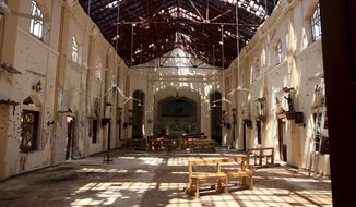 In this Thursday, April 25, 2019 photo, sunlight steams in from gaping holes at St. Sebastian&#39;s Church in Negombo, north of Colombo, Sri Lanka. Nearly a week later, the smell of death is everywhere, though the bodies are long gone. Yet somehow, there’s a beauty to St. Sebastian’s, a neighborhood church in a Catholic enclave north of Sri Lanka’s capital, where a man calmly walked in during Easter services with a heavy backpack and blew himself up. (AP Photo/Manish Swarup)