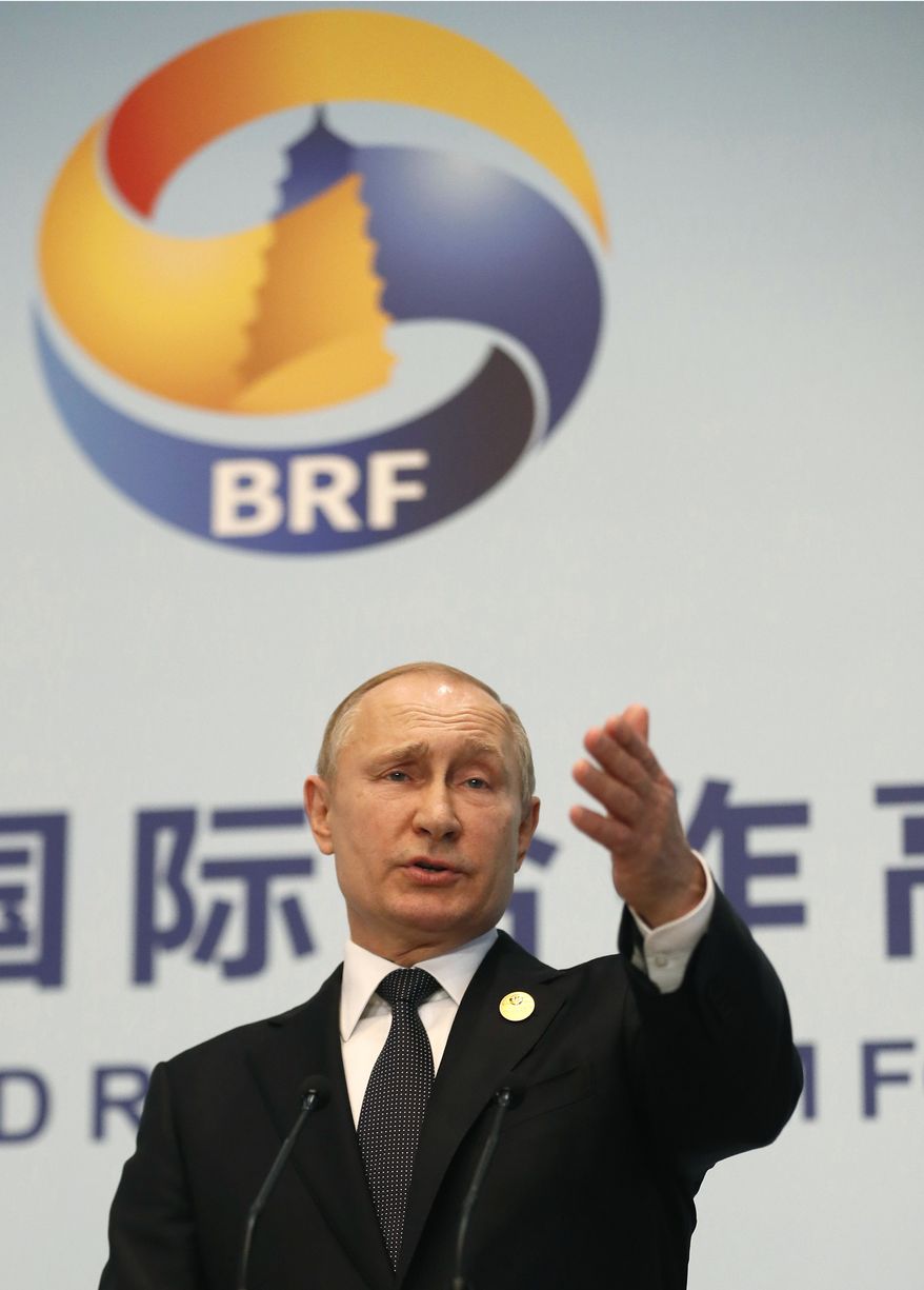 Russian President Vladimir Putin gestures while speaking to the media after the Belt and Road Forum in Beijing, China, Saturday, April 27, 2019. Putin said Belt and Road fits with Moscow's initiative to develop a common market with four of its neighbors.(Sergei Ilnitsky/Pool Photo via AP) **FILE**