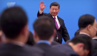 Chinese President Xi Jinping waves as he leaves after a press conference at the closing of the Belt and Road Forum at Yanqi Lake on the outskirts of Beijing, Saturday, April 27, 2019. Xi called Saturday for more countries to join China&#39;s sprawling infrastructure-building initiative in the face of U.S. opposition to a project Washington worries is increasing Beijing&#39;s strategic influence. (AP Photo/Mark Schiefelbein)