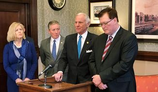 FILE - In this Feb. 20, 2019, file photo, South Carolina Education Superintendent Molly Spearman, from left, State Sen. Greg Hembree, Gov. Henry McMaster and House Speaker Jay Lucas discuss an education reform bill they want passed this session in Columbia, S.C. Opposition from teachers helped stall the education overhaul bill in the Senate and teachers plan a school day rally to ask lawmakers to do more. (AP Photo/Jeffrey Collins, File)