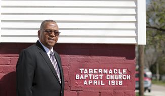 In an April 13, 2019 photo, Rev. Raymond Burt stands in front of Tabernacle Missionary Baptist Church in Council Bluffs, Iowa. This year, the church is celebrating 115 years as one of the oldest African American churches in Council Bluffs.  (Susan Payne/The Daily Nonpareil via AP)