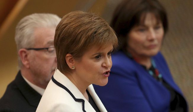 First Minister of Scotland Nicola Sturgeon issues a statement on Brexit and independence in the main chamber at the Scottish Parliament, Edinburgh, Wednesday April 24, 2019. Sturgeon says she wants to hold a new referendum on independence from the U.K. by 2021 if Britain leaves the European Union, though she acknowledges she lacks the power to make it happen on her own. Scots voted against independence by 55% to 45% in a 2014 referendum billed as a once-in-generation poll. (Jane Barlow/PA via AP)