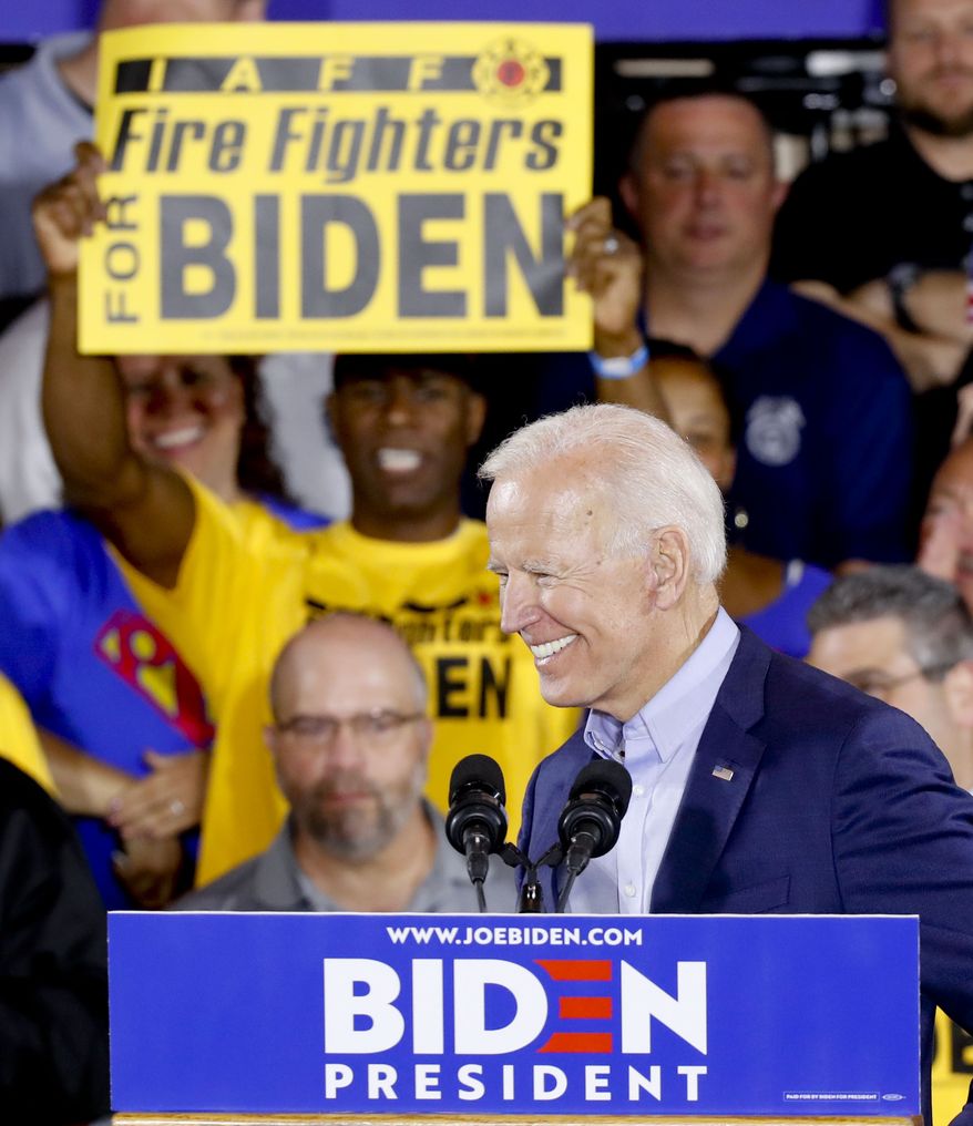 Democratic presidential hopeful and former Vice President Joe Biden smiles at the crowd as they cheer him before he spoke at a campaign stop at a Teamsters union hall in PittsburghMonday, April 29, 2019. (AP Photo/Keith Srakocic)