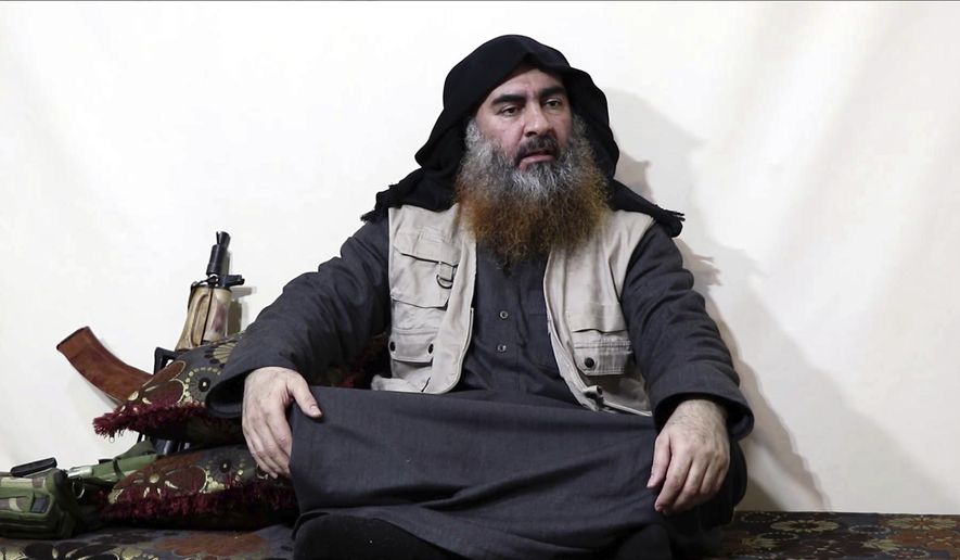 This image made from video posted on a militant website on Monday, April 29, 2019, purports to show the leader of the Islamic State group, Abu Bakr al-Baghdadi, being interviewed by his group&#39;s Al-Furqan media outlet. Al-Baghdadi acknowledged in his first video since June 2014 that IS lost the war in the eastern Syrian village of Baghouz that was captured last month by the Kurdish-led Syrian Democratic Forces. (Al-Furqan media via AP)