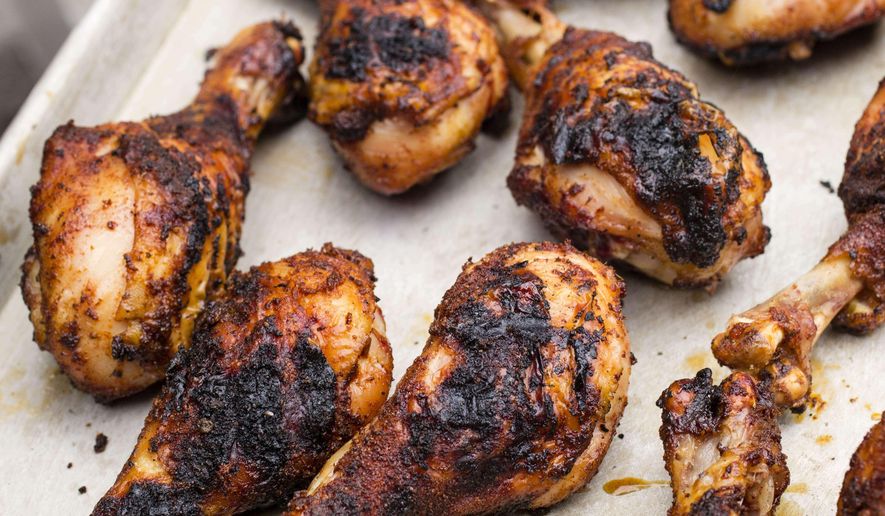 This photo provided by America's Test Kitchen shows Grill-Roasted Spice-Rubbed Chicken Drumsticks. (America's Test Kitchen via AP)