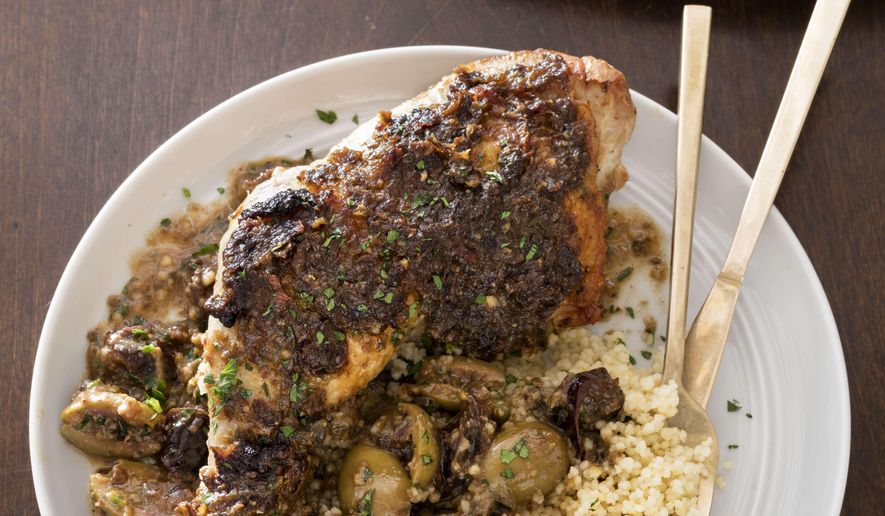 This photo provided by America's Test Kitchen shows Chicken Marbella. (Daniel J. van Ackere/America's Test Kitchen via AP)