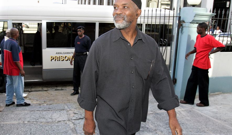 FILE - In this Aug. 6, 2007, file photo, Guyanese Abdul Kadir, former member of the South American nation's Parliament, arrives at the Magistrates' Court for an extradition hearing in downtown Port-of-Spain, Trinidad. The U.S. government has chastised the South American country of Guyana for honoring the life of Abdul Kadir, convicted of plotting to blow up fuel tanks at New York’s John F. Kennedy Airport. The U.S. said in a statement Monday, April 29, 2019, that the resolution upholding the life and work of Kadir was an “insensitive and thoughtless act” that disregarded the gravity of his actions. (AP Photo/Andres Leighton)