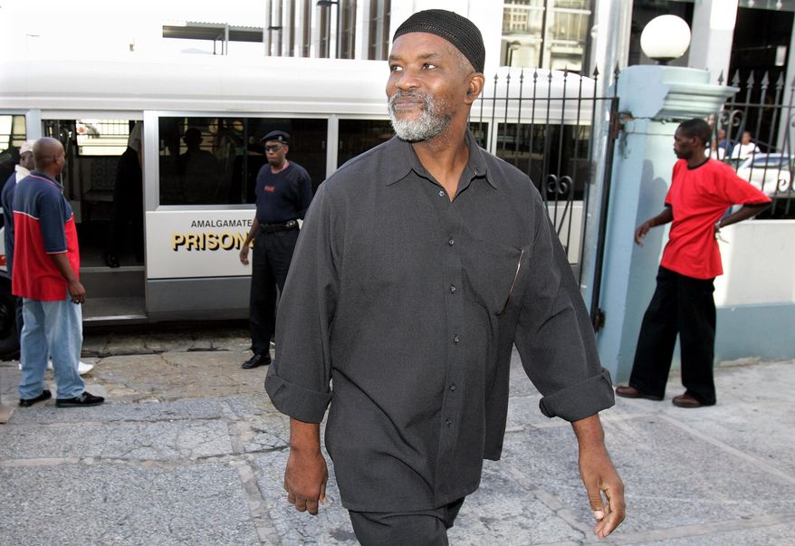 FILE - In this Aug. 6, 2007, file photo, Guyanese Abdul Kadir, former member of the South American nation's Parliament, arrives at the Magistrates' Court for an extradition hearing in downtown Port-of-Spain, Trinidad. The U.S. government has chastised the South American country of Guyana for honoring the life of Abdul Kadir, convicted of plotting to blow up fuel tanks at New York’s John F. Kennedy Airport. The U.S. said in a statement Monday, April 29, 2019, that the resolution upholding the life and work of Kadir was an “insensitive and thoughtless act” that disregarded the gravity of his actions. (AP Photo/Andres Leighton)