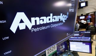 FILE - In this April 12, 2019, file photo the logo for Anadarko Petroleum Corp. appears above a trading post on the floor of the New York Stock Exchange. Anadarko plans to restart takeover talks with Occidental, less than a week after Occidental made a competing bid to Chevron’s deal. Anadarko Petroleum Corp. said Monday, April 29 that it’s resuming talks with Occidental because its board determined Occidental’s offer could possibly be a superior proposal to the Chevron transaction.  (AP Photo/Richard Drew, File)