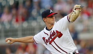 Atlanta Braves starting pitcher Mike Soroka works against the San Diego Padres in the first inning of a baseball game Monday, April 29, 2019, in Atlanta. (AP Photo/John Bazemore)