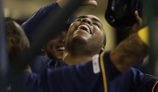 Milwaukee Brewers&#39; Jesus Aguilar celebrates his three-run home run during the first inning of a baseball game against the Colorado Rockies Monday, April 29, 2019, in Milwaukee. (AP Photo/Morry Gash)