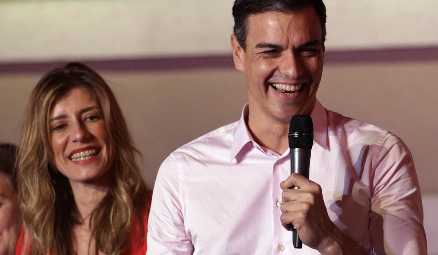Spanish Prime Minister and Socialist Party candidate Pedro Sanchez speaks to supporters gathered at the party headquarters waiting for results of the general election in Madrid, Sunday, April 28, 2019. Spain&#39;s governing Socialists won the country&#39;s national election Sunday but will need the backing of smaller parties to stay in power, while a far-right party rode a groundswell of support to enter the lower house of parliament for the first time in four decades, provisional results showed. At left is his wife Maria Begona Gomez. (AP Photo/Andrea Comas)