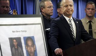 United States Attorney Nick Hanna stands next to photos of Mark Steven Domingo, during a news conference in Los Angeles on Monday, April 29, 2019. A terror plot by Domingo, an Army veteran who converted to Islam and planned to bomb a white supremacist rally in Southern California as retribution for the New Zealand mosque attacks was thwarted, federal prosecutors said Monday. (AP Photo/Richard Vogel) **FILE**