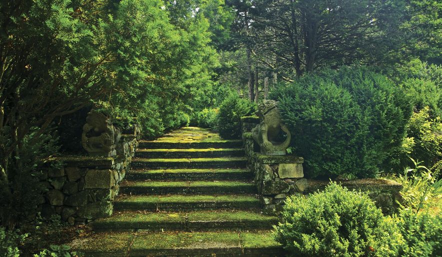 This photo provided by Rizzoli Press shows moss-covered steps guarded by a pair of centuries-old Chinese dragons in Greenwood Gardens, Short Hills, N.J. The photograph is featured in the book "Garden Wild: Wildflower Meadows, Prairie-Style Plantings, Rockeries, Ferneries, and Other Sustainable Designs Inspired by Nature" by Andre Baranowski. (Andre Baranowski/Rizzoli Press via AP)
