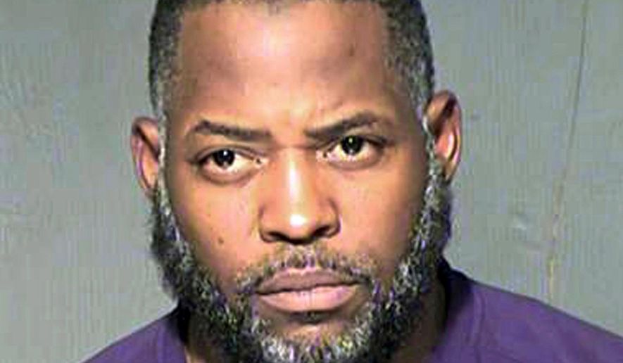 FILE - This undated file photo provided by the Maricopa County Sheriff&#39;s Department shows Abdul Malik Abdul Kareem. Kareem was convicted of providing guns to Elton Simpson and Nadir Soofi, two Islamic State followers who attacked a Prophet Muhammad cartoon contest nearly four years ago in Garland, Texas. Kareem&#39;s attorneys say the FBI had installed a surveillance camera outside Simpson and Soofi&#39;s apartment, but didn&#39;t reveal the existence of the camera until three years after their client&#39;s trial. (Maricopa County Sheriff&#39;s Department via AP, File)
