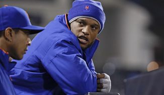 New York Mets&#39; Robinson Cano talks to teammates during the ninth inning of a baseball game against the Cincinnati Reds, Monday, April 29, 2019, in New York. (AP Photo/Frank Franklin II)