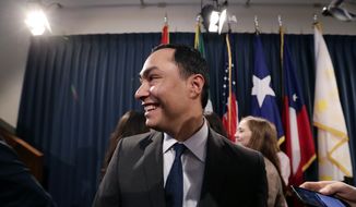 File-This April 17, 2019, file photo shows U.S. Rep. Joaquin Castro, D-Texas, center, leaving a news conference in Austin, Texas. Castro, the Texas Democrat who leads the Congressional Hispanic Caucus, said Wednesday he was again passing up a Senate run despite hinting for months that 2020 might finally be his year. (AP Photo/Eric Gay, File)