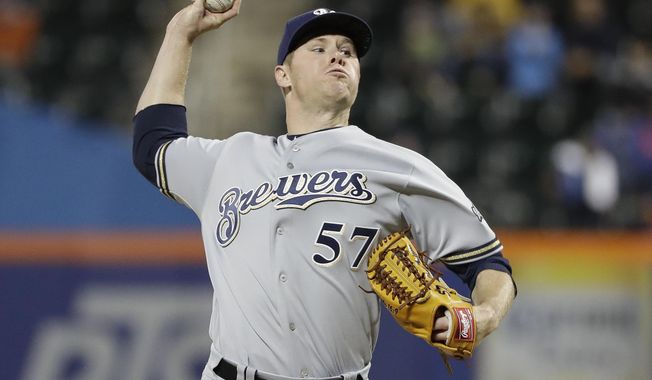 Milwaukee Brewers' Chase Anderson delivers a pitch during the first inning of a baseball game against the New York Mets Friday, April 26, 2019, in New York. (AP Photo/Frank Franklin II)