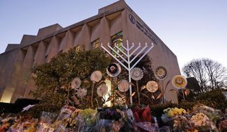 File - In this Sunday, Dec. 2, 2018 file photo, a menorah is installed outside the Tree of Life Synagogue in preparation for a celebration service at sundown on the first night of Hanukkah, in the Squirrel Hill neighborhood of Pittsburgh. A gunman shot and killed 11 people while they worshipped Saturday, Oct. 27, 2018 at the temple. Israeli researchers reported Wednesday that violent attacks against Jews spiked significantly last year, with the largest reported number of Jews killed in anti-Semitic acts in decades, leading to an &amp;quot;increasing sense of emergency&amp;quot; among Jewish communities worldwide. (AP Photo/Gene J. Puskar, File)