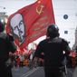 Communist party supporters carry a flag depicting Soviet Union founder Lenin during a May Day rally in St.Petersburg, Russia, Wednesday, May 1, 2019. (AP Photo/Dmitri Lovetsky) **FILE**