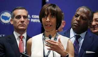 In this June 8, 2018, file photo, then-Baltimore Mayor Catherine Pugh addresses a gathering during the annual meeting of the U.S. Conference of Mayors in Boston. Baltimore&#x27;s mayor resigned under pressure Thursday, May 2, 2019, amid a flurry of investigations into whether she arranged bulk sales of her self-published children&#x27;s books to disguise hundreds of thousands of dollars in kickbacks. (AP Photo/Charles Krupa, File) ** FILE **