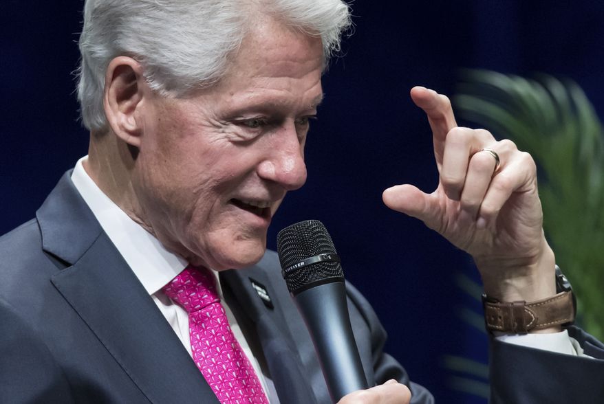 Former U.S. President Bill Clinton speaks during a question and answer conversation with his wife, former U.S. Secretary of State Hillary Clinton, as part of their North American tour in Vancouver, British Columbia, on Thursday, May 2, 2019. (Darryl Dyck/The Canadian Press via AP)
