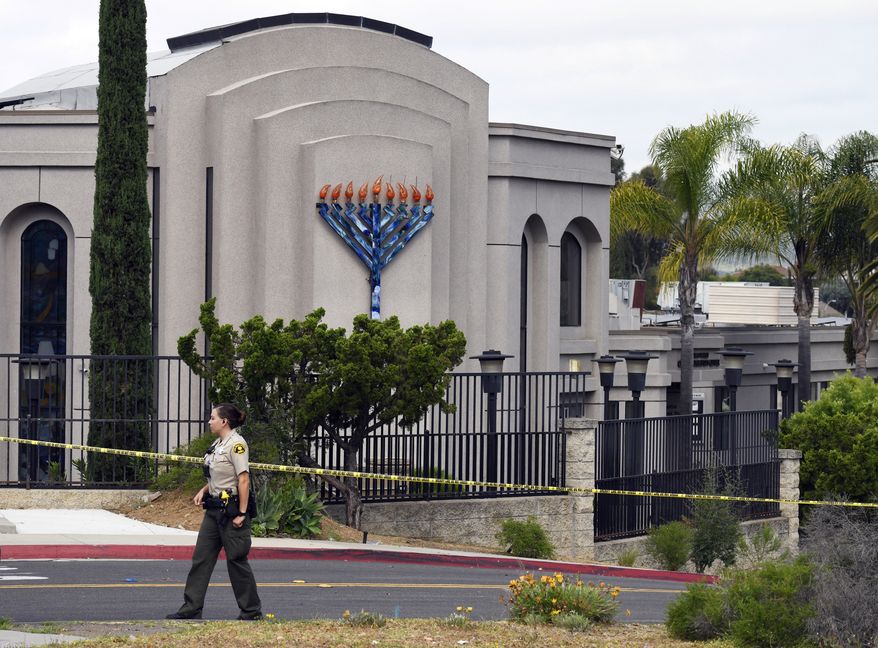  In this Sunday, April 28, 2019 file photo, a San Diego county sheriff&#39;s deputy stands in front of the Poway Chabad Synagogue in Poway, Calif. The gunman who attacked the synagogue last week fired his semi-automatic rifle at Passover worshippers after walking through the front entrance that synagogue leaders identified last year as needing improved security. The synagogue applied for a federal grant to better protect that area. The money, $150,000, was approved in September but only arrived in late March. &quot;Obviously we did not have a chance to start using the funds yet,&quot; Rabbi Scimcha Backman told The Associated Press. (AP Photo/Denis Poroy, File) **FILE**