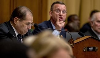 Ranking Member Rep. Doug Collins, R-Ga., center, accompanied by Judiciary Committee Chairman Jerrold Nadler, D-N.Y., left, speaks as Attorney General William Barr does not appear before a House Judiciary Committee hearing on Capitol Hill in Washington, Thursday, May 2, 2019.  (AP Photo/Andrew Harnik)