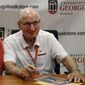 In this Sept. 29, 2018, file photo, Vince Dooley poses for a photo while signing autographs before a game between Georgia and Tennessee in Athens, Ga. (Jenn Finch/Athens Banner-Herald via AP, File) **FILE**