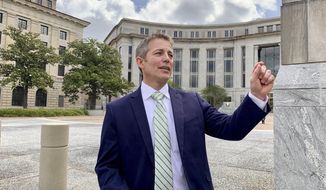 Former Alabama legislator Ed Henry smiles as he speaks with reporters on Thursday, May 2, 2019 outside the federal courthouse in Montgomery, Ala. A federal judge has sentenced Henry to two years of probation for his role in a health care fraud case. (AP Photo/Kim Chandler)