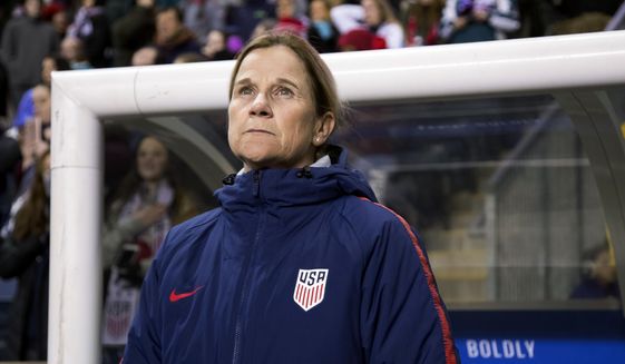 In this Feb. 27, 2019, file photo, USA head coach Jill Ellis looks on before the first half of SheBelieves Cup soccer match against Japan in Chester, Pa. (AP Photo/Chris Szagola, File)