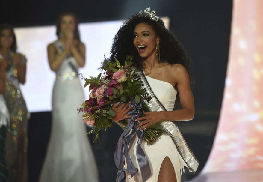 Miss North Carolina Cheslie Kryst wins the 2019 Miss USA final competition in the Grand Theatre in the Grand Sierra Resort in Reno, Nev., on Thursday, May 2, 2019. Alejandra Gonzalez of New Mexico was the first-runner up, and Oklahoma's Triana Browne the second-runner up during the competition. (Jason Bean/The Reno Gazette-Journal via AP)