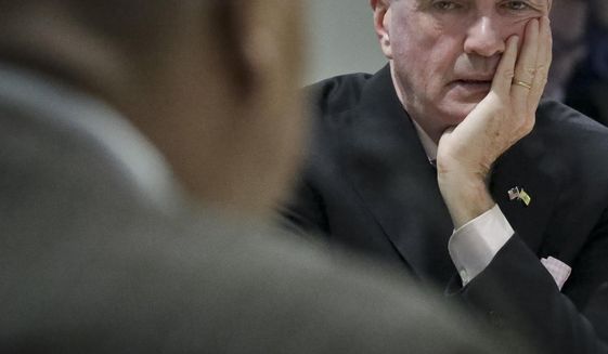 New Jersey Gov. Phil Murphy, center, listen during a hearing on the Gateway Project before a Congressional delegation at Port Authority headquarters, Friday May 3, 2019, in New York. (AP Photo/Bebeto Matthews)