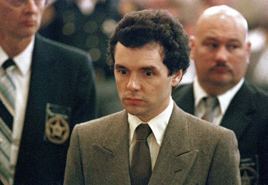FILE – In this Sept. 1987 file photo, serial killer Donald Harvey stands before a judge during sentencing in Cincinnati. James Elliott, an Ohio inmate has been charged in the fatal 2017 prison beating of a serial killer dubbed the "Angel of Death." The indictment announced Friday, May 3, 2019 comes two years after Donald Harvey died when he was beaten at the state prison in Toledo. The former nurse's aide was serving multiple life sentences after admitting in 1987 to killing three dozen hospital patients in Ohio and Kentucky during the 1970s and '80s. (AP Photo/Al Berhman, File)