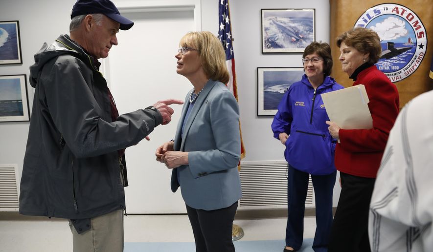 Secretary of the Navy Richard V. Spencer, left, speaks with Sen. Maggie Hassan, D-NH, after a news conference at the Portsmouth Naval Shipyard, Friday, May, 3, 2019, in Kittery, Maine. Members of Maine and New Hampshire's congressional delegations, including Sen. Susan Collins, R-Maine, and Sen. Jeanne Shaheen, D-NH, at right, have been working to prevent shipyard construction projects from being cut to fund President Donald Trump's wall at the southern border. (AP Photo/Robert F. Bukaty)