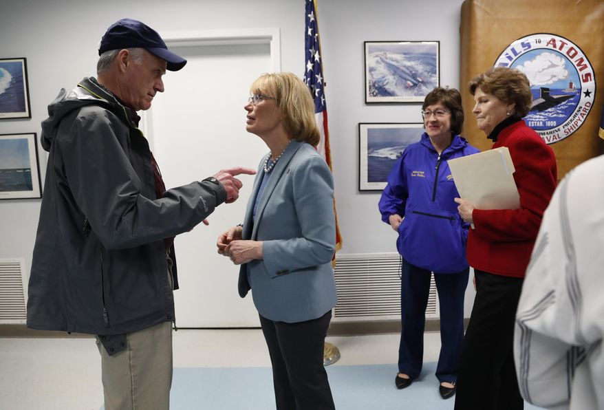 Secretary of the Navy Richard V. Spencer, left, speaks with Sen. Maggie Hassan, D-NH, after a news conference at the Portsmouth Naval Shipyard, Friday, May, 3, 2019, in Kittery, Maine. Members of Maine and New Hampshire's congressional delegations, including Sen. Susan Collins, R-Maine, and Sen. Jeanne Shaheen, D-NH, at right, have been working to prevent shipyard construction projects from being cut to fund President Donald Trump's wall at the southern border. (AP Photo/Robert F. Bukaty)