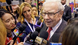 Warren Buffett, Chairman and CEO of Berkshire Hathaway, speaks to reporters during a tour of the CHI Health convention center where various Berkshire Hathaway companies display their products, before presiding over the annual shareholders meeting in Omaha, Neb., Saturday, May 4, 2019. An estimated 40,000 people are expected in town for the event, where Buffett and his Vice Chairman Charlie Munger will preside over the meeting and spend hours answering questions. (AP Photo/Nati Harnik)
