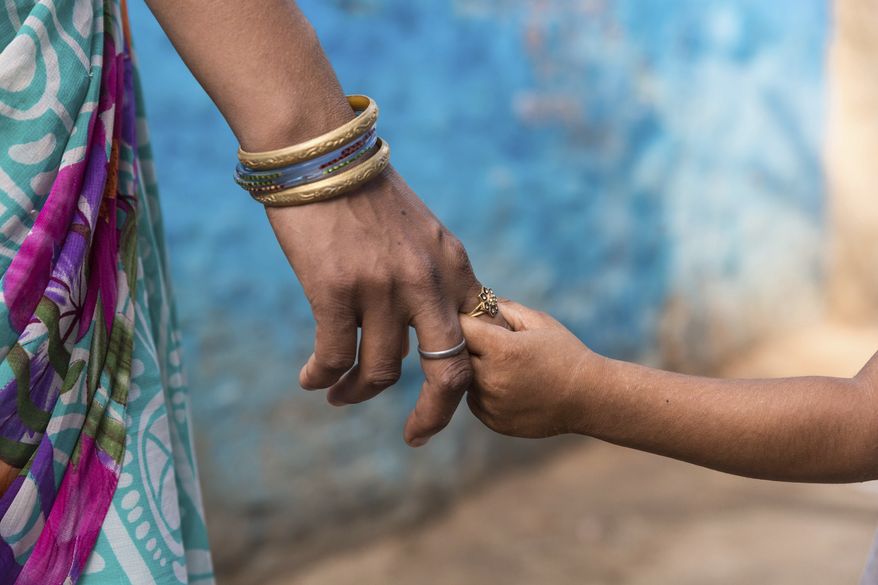 Although you may not always see the evidence, your words will echo across the years in the hearts and minds of your children and perhaps to generations yet unborn. Choose them carefully, share them lovingly, Rebecca Hagelin writes. (AP Photo/Rajesh Kumar Singh) **FILE**